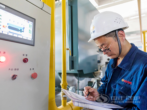 ZOZEN service personnel recorded boiler operation data on the control cabinet